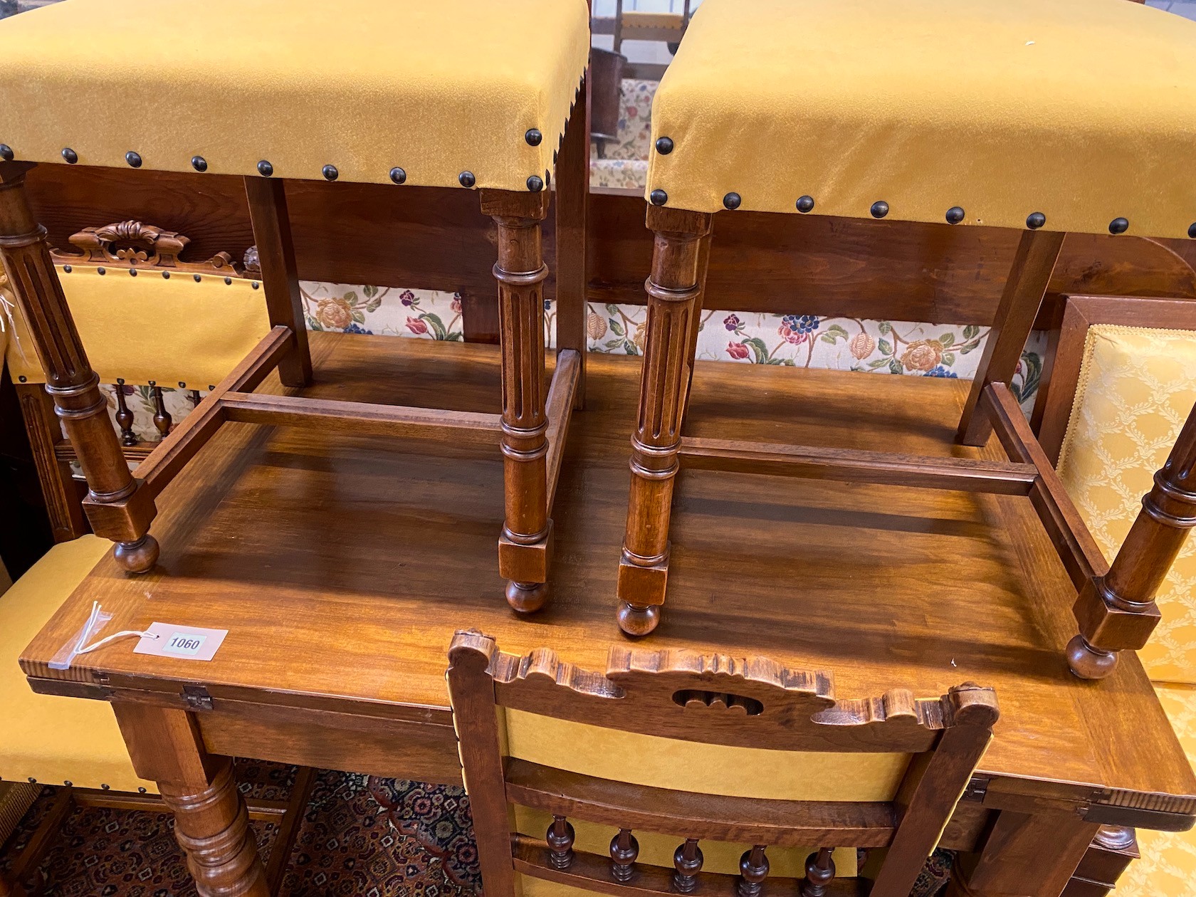 A late 19th century French rectangular walnut folding dining table, length 96cm, width 63cm, height 79cm and four 19th century French dining chairs